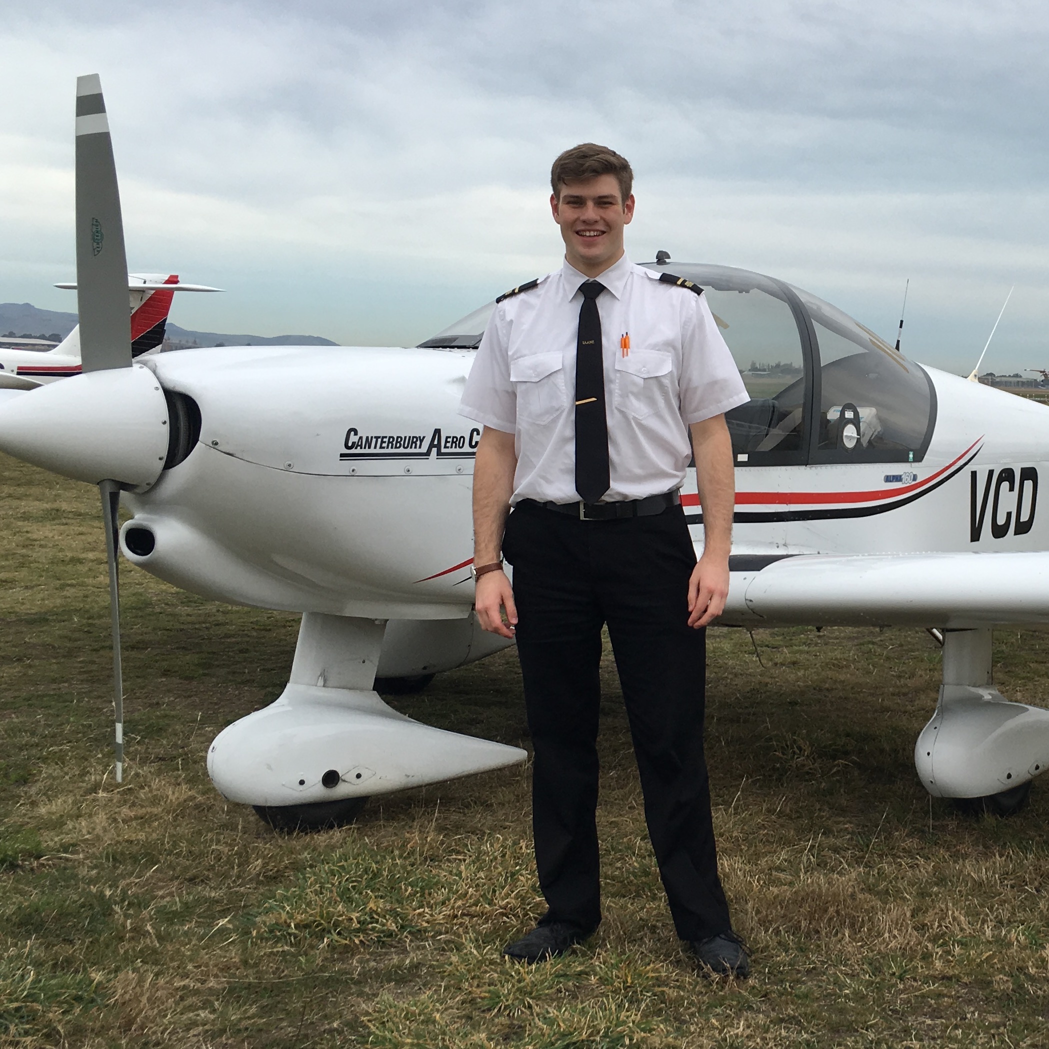 Photo of past student Toby with his plane.